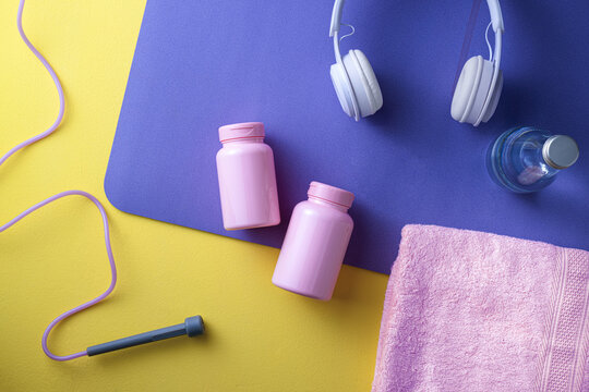 Fitness essentials laid out for a workout session with jump rope