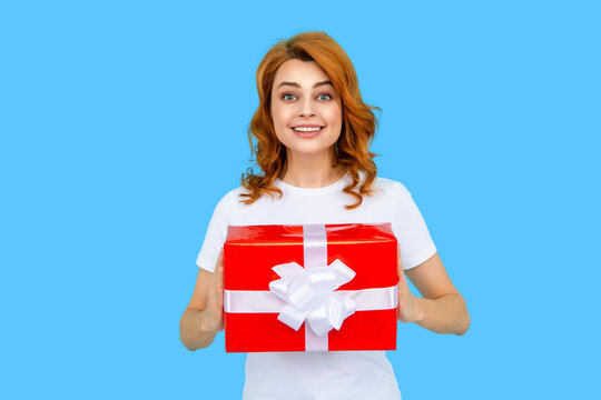 Happy Mothers Day. Gifts and presents for Mothers Day. Happy mother holding gift. Redhead woman receiving gift. surprise. Celebrating Mothers Day or birthday. Womans or Mothers Day concept.