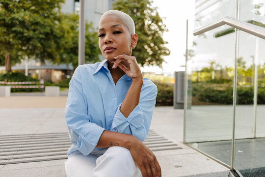 Confident businesswoman posing in modern urban environment
