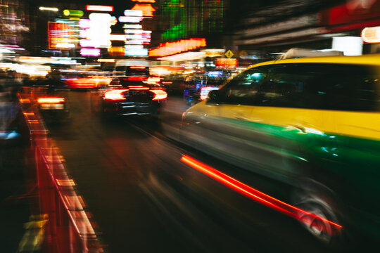 Taxi Speeding Through Bangkok at Night