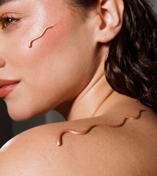 Skin Treatment Being Applied on Back of a Woman in a Spa Setting