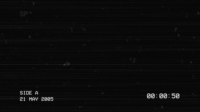 Vintage VHS tape tracking distortion with 2005 date and timecode
