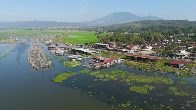 Aerial view of Rawa Pening lake and floating fish farms, Indonesia.