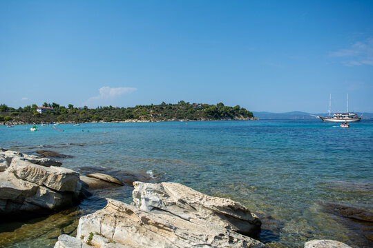 15th September 2026- Halkidiki, Greece. Tourists swimming in the crystal-clear turquoise waters of the Blue Lagoon near Diaporos Island, Sithonia, a popular Mediterranean summer travel destination.