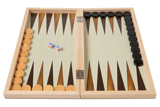 Wooden backgammon board with checkers and dice angle view isolated on white background