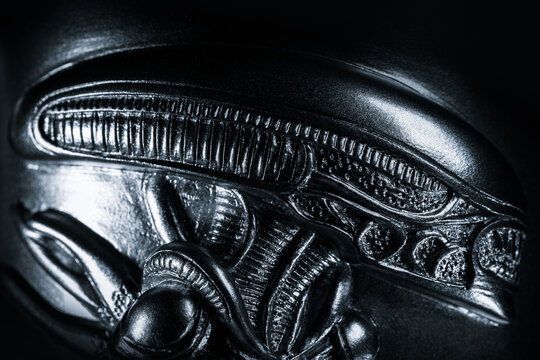 Alien xenomorph figure head showing intricate biomechanical texture and glossy carapace, inspired by H.R. Giger design and Ridley Scott sci-fi universe