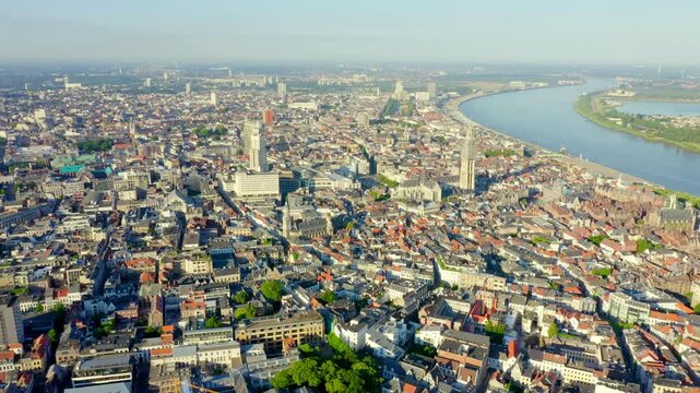 Antwerp, Belgium. Flying over the roofs of the historic city. Schelde (Esco) river. Drone footage
