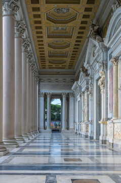 Ornate coffered ceiling and Corinthian colonnade portico at Basilica of Saint Paul Outside the Walls in Rome Italy, interior architectural view