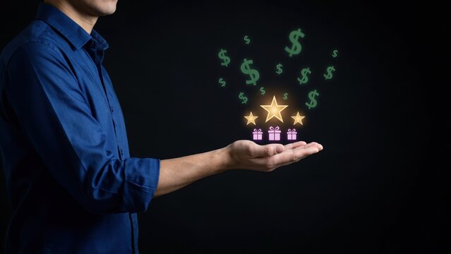 A businessman holding glowing stars and gift boxes with floating dollar signs against a dark background. Ideal for customer loyalty and reward program marketing concepts.