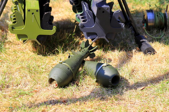 Two green mortar mines with modified tails. High explosive artillery fragmentation ammunition for army weapon.