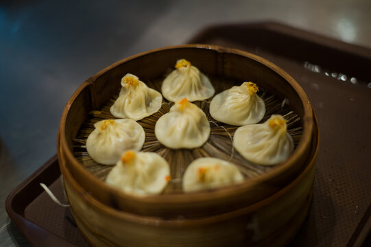 Steamed dumplings arranged in a bamboo basket