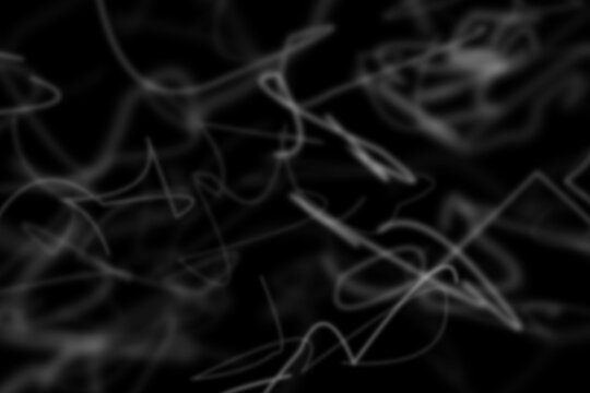 Abstract background, with white glowing, scribbled lines and, tangled light trails, on black