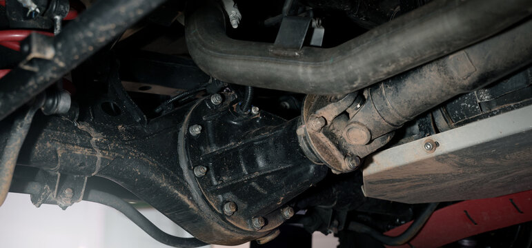 Car suspension and drive shaft. Structure of EV car spare parts. Such as Front or Rear suspension Shock absorber suspension Brake. Elements of the suspension and Chassis structure. Car service repair.