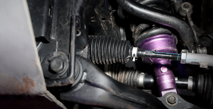 Car suspension and drive shaft. Structure of EV car spare parts. Such as Front or Rear suspension Shock absorber suspension Brake. Elements of the suspension and Chassis structure. Car service repair.