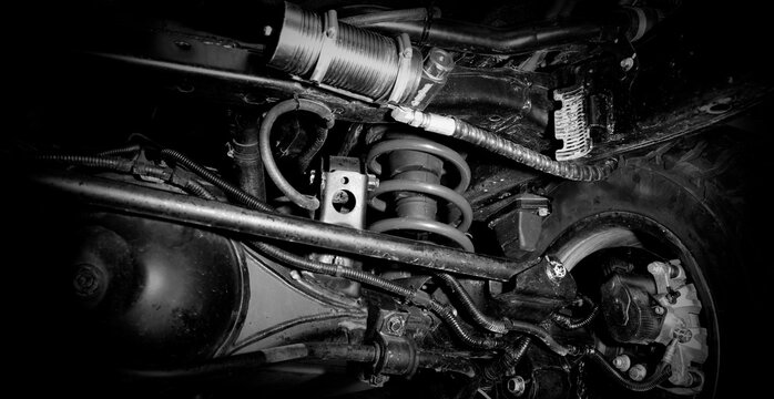 Car suspension and drive shaft. Structure of EV car spare parts. Such as Front or Rear suspension Shock absorber suspension Brake. Elements of the suspension and Chassis structure. Car service repair.