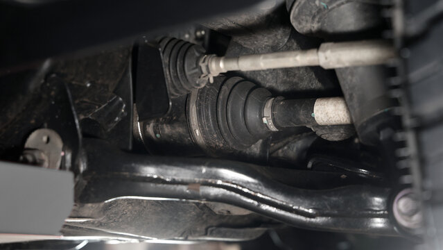 Car suspension and drive shaft. Structure of EV car spare parts. Such as Front or Rear suspension Shock absorber suspension Brake. Elements of the suspension and Chassis structure. Car service repair.
