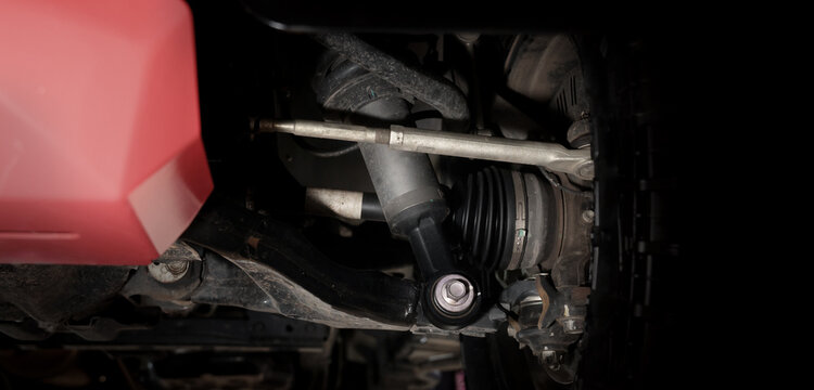 Car suspension and drive shaft. Structure of EV car spare parts. Such as Front or Rear suspension Shock absorber suspension Brake. Elements of the suspension and Chassis structure. Car service repair.