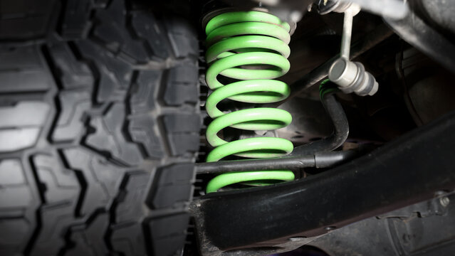 Car suspension and drive shaft. Structure of EV car spare parts. Such as Front or Rear suspension Shock absorber suspension Brake. Elements of the suspension and Chassis structure. Car service repair.