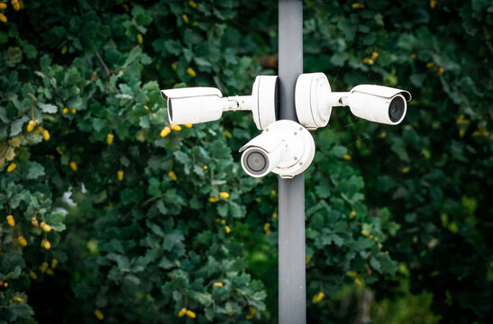 A complex of outdoor surveillance camera on a pole in the park. A complex of outdoor surveillance camera on a pole in the park. CCTV camera on a pole in the park. camera on a pole.