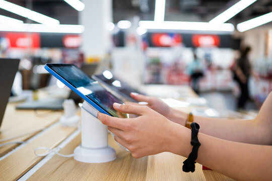 Testing new tablet in electronics store