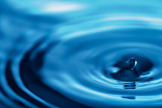 276.Blue Water Droplet Impact with Ripple and Splash