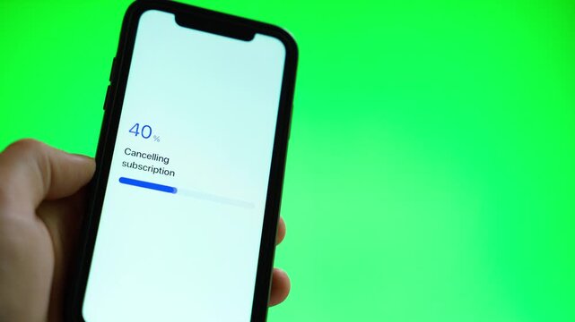 Cancelling subscription on smartphone screen against green background. Subscription cancelled confirmation with progress bar close-up