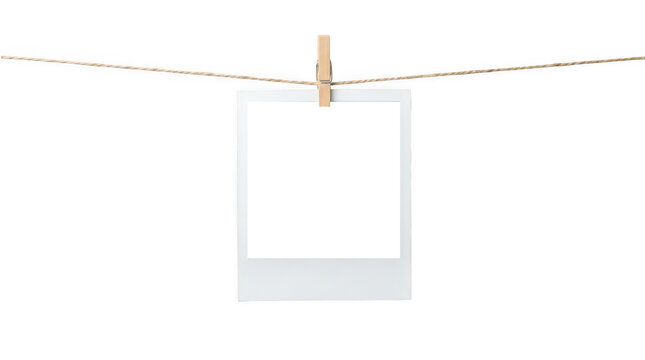 A single blank instant photo hanging on a string isolated on transparent background