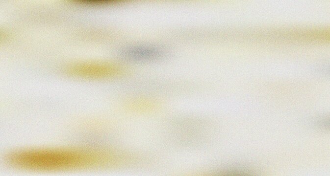 Minimalistic light off white surface with extremely faint and delicate yellow and brown diffused blurs offering understated elegance