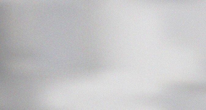 Modern understated grey gradient with subtle grain texture and soft fluctuating light for atmospheric digital designs