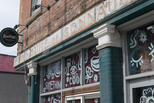 ghost sign of The Duke of Connaught, now occupied by DROM Taberna, on the exterior of a heritage property at 456-458 Queen St W, Toronto (known as Collins Block, 1870/1891)