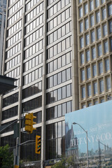Obraz premium buildings in the Bloor Yorkville area with tarp banner for a future location of Tiffany & Co, 1200 Bay St/66 Bloor St W, Toronto