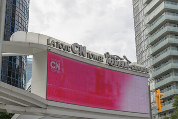 Obraz premium La Tour CN Tower + Ripley's Aquarium of Canada sign facing Front St W (near Isabella Valancy Crawford Park), Toronto