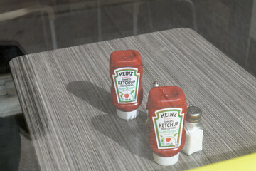 Obraz premium Heinz upside-down plastic squeeze ketchup bottle on a diner table at Eggsmart, a breakfast restaurant, 645 Bay St, Toronto