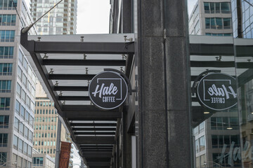 Obraz premium wall-mounted round projecting sign outside Hale Coffee Company located here at 1 Adelaide St E, Toronto