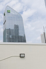 Obraz premium TD Terrace, designed by Adrian Smith + Gordon Gill Architecture (AS+GG), with corporate logo sign and a concrete block wall, Toronto