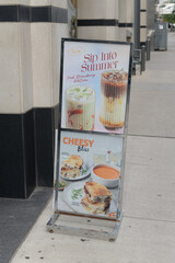 Obraz premium freestanding metal poster frame with menu options ads outside Au Pain Doré, a pastry shop, located here at 20 Adelaide St E, Toronto