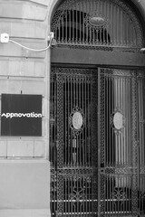 Obraz premium black and white rounded arch portal and sign of Appnovation, a web desiger, located at 241 Spadina Av (built in 1910 as Consolidated Plate Glass Company Building, ), Toronto