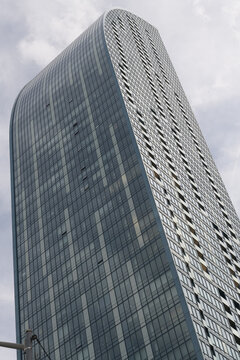 an upward view of L-Tower, a condominium complex, designed by Daniel Libeskind, with Page + Steele / IBI Group, in contemporary deconstructivist style, located at 8 The Esplanade, Toronto (northwest c
