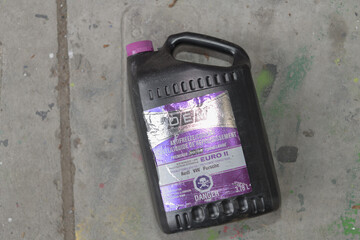 Fototapeta premium top-down view of a discarded container of Recochem OEM Extended Life Euro II Antifreeze/Coolant in Toronto