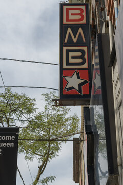 projecting wall-mounted sign outside Banh Mi Boys, a sandwich shop, located at 392 Queen St W, Toronto