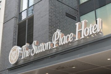 Obraz premium exterior building facade and sign of The Sutton Place Hotel located at 355 King St W (at Blue Jays Way), Entertainment District, Toronto