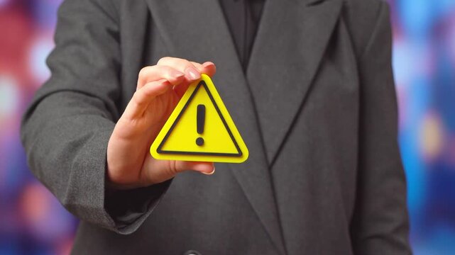 Businesswomen and warning sign. Warnings for businesses and entrepreneurs. New rules and laws, taxes. Regulatory alert concept, compliance pressure and financial risk awareness. Policy changes