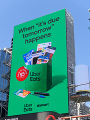 Obraz premium large-format digital spectacular featuring advertisement of Uber Eats and Wal-Mart Canada facing Sankofa Square, Toronto