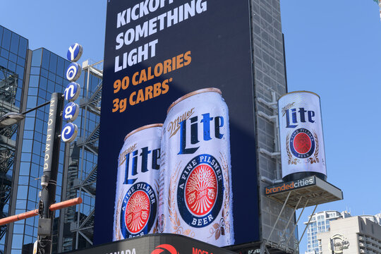 large-format spectacular with advertising for Molson Coors Brewing Company "Miller Lite" facing Sankofa Square, Toronto