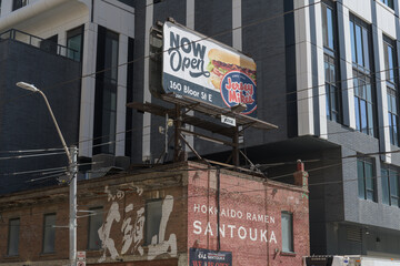Obraz premium rooftop billboard advertising Jersey Mike's - 160 Bloor St E location - on Hokkaido Ramen Santouka, ramen restaurant at 91 Dundas St E, Toronto