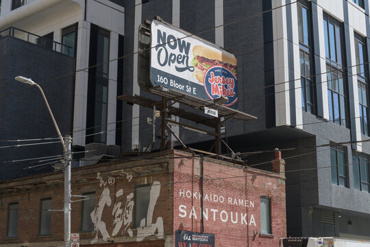 rooftop billboard advertising Jersey Mike's - 160 Bloor St E location - on Hokkaido Ramen Santouka, ramen restaurant at 91 Dundas St E, Toronto