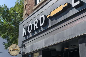 Obraz premium exterior building facade and signage of Nord Lyon Queen St West, a bakery, 665 Queen W Toronto