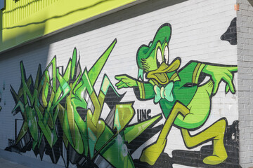 Obraz premium UNC (a Toronto graffiti crew) mural art outside FreshCo, a grocery store, located here at 22 Northcote Av