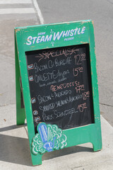 Obraz premium sidewalk a-frame chalkboard sign with Steam Whistle branding in Toronto
