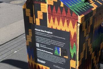 Obraz premium sign on metal container at Sankofa Square with traditional Ghanaian Kente cloth patterns by Adams Kofi Amaning, Toronto
